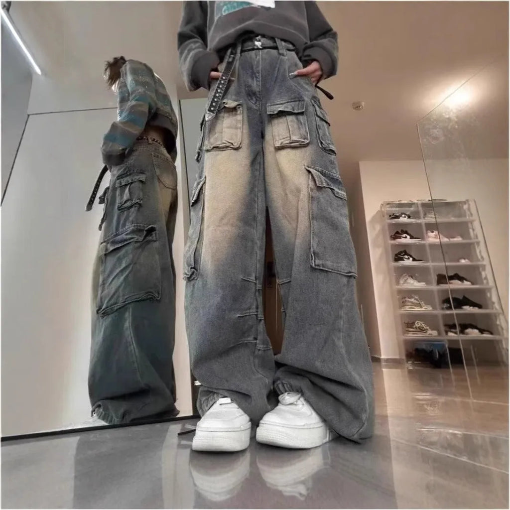 Loose fit distressed denim jeans with multiple pockets in light blue wash