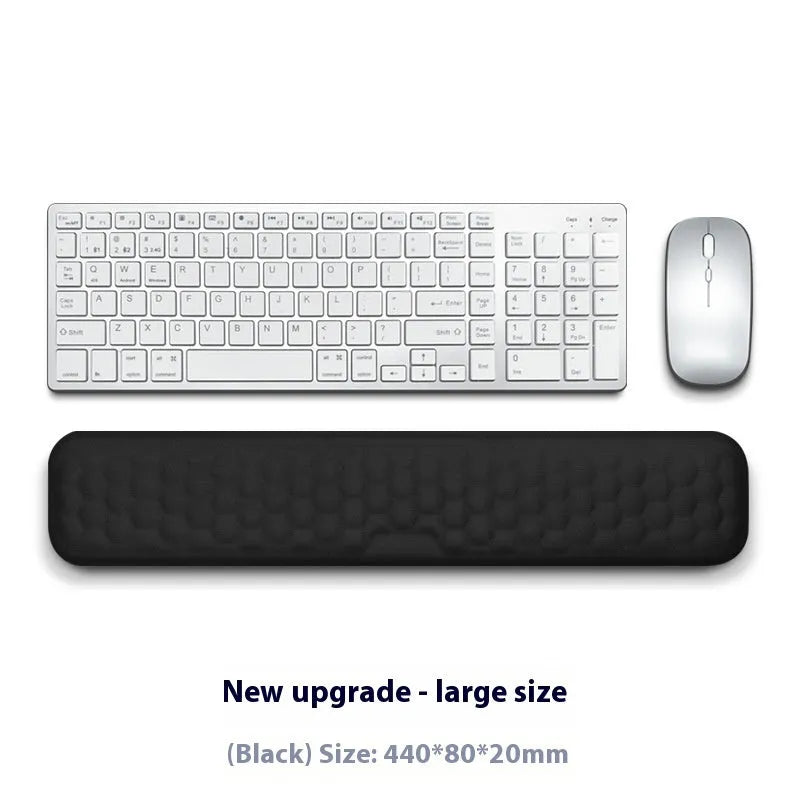 Memory foam mouse wrist rest with silicone base in black cloth and grey leather style options.