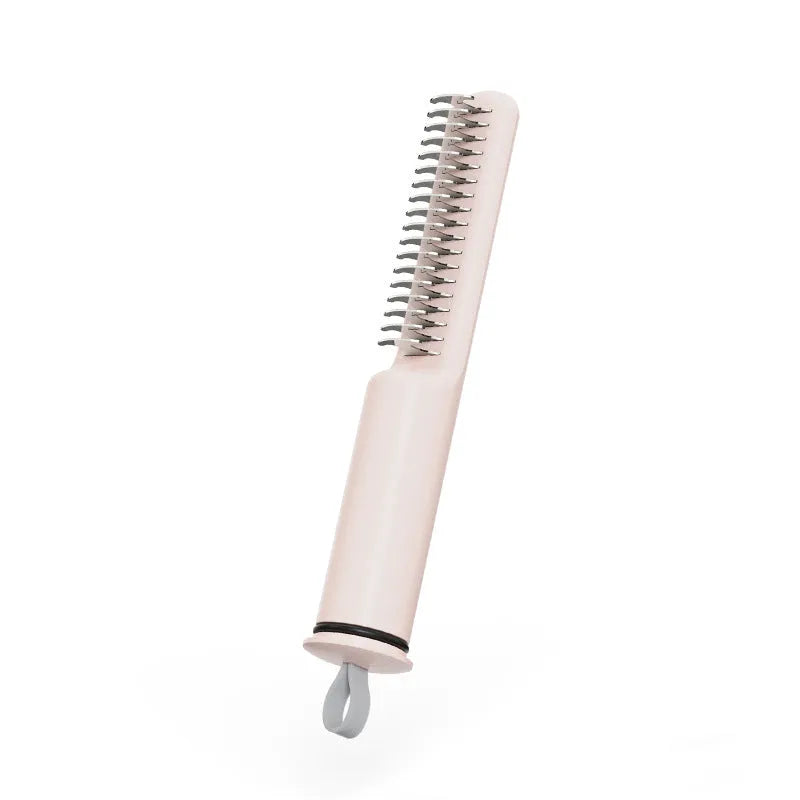 Pink and white pet dematting combs with stainless steel teeth on a wooden surface