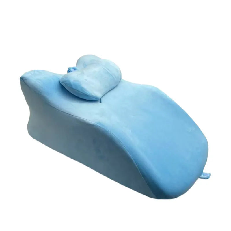 A stomach sleeper pillow designed for lying on your front, shown in blue, dark grey, green, and light grey colour options.