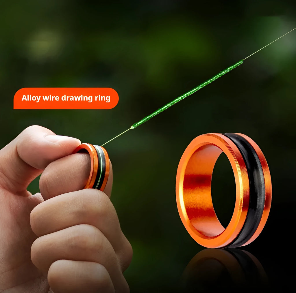 Alloy fishing hand guard pull loop tool in orange and silver colours on a plain background.
