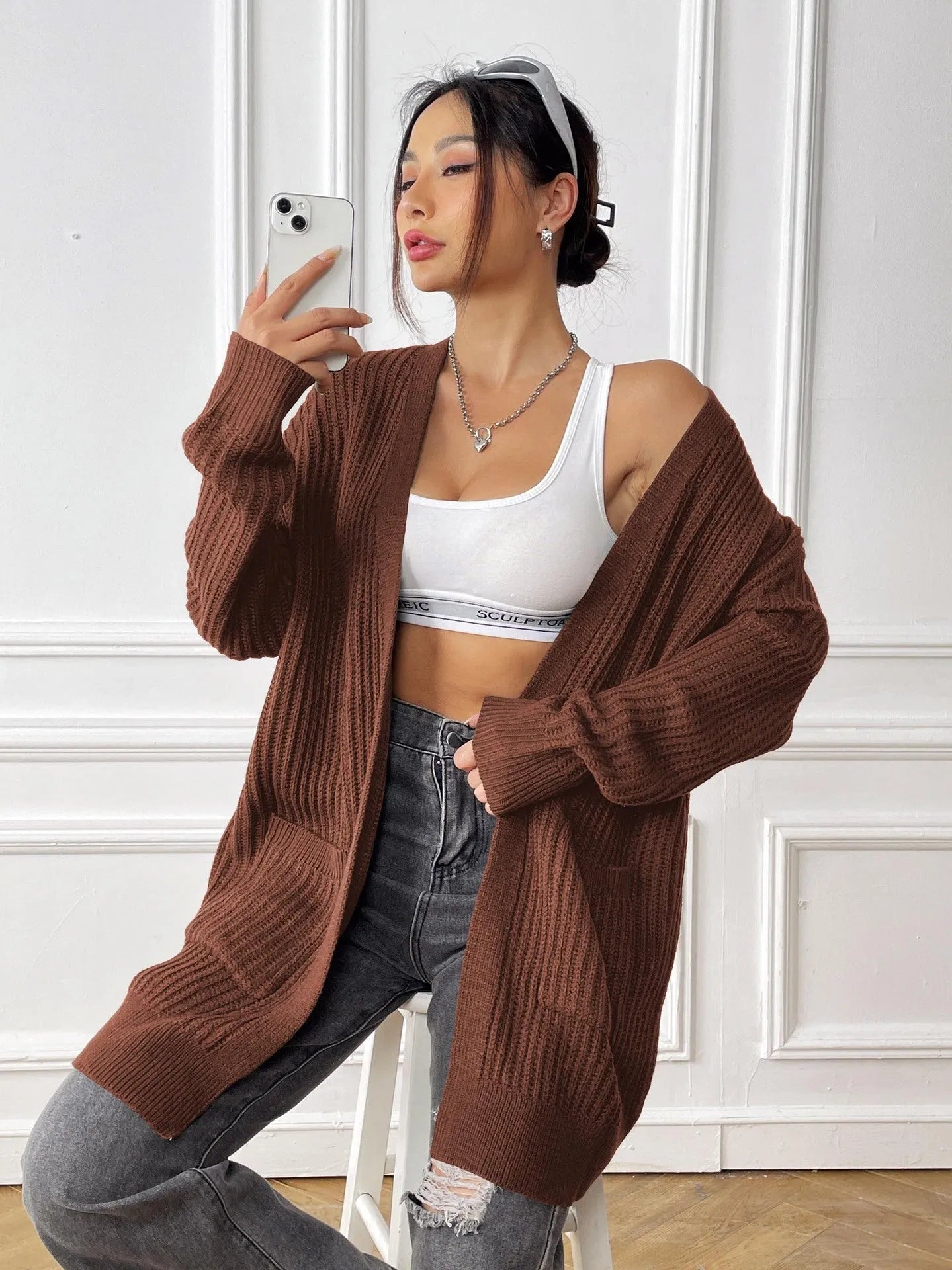 Women's loose fit acrylic cardigan with double pockets in dark green colour