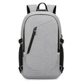 Blue Oxford cloth computer backpack with front pocket, shown next to grey and black colour options.