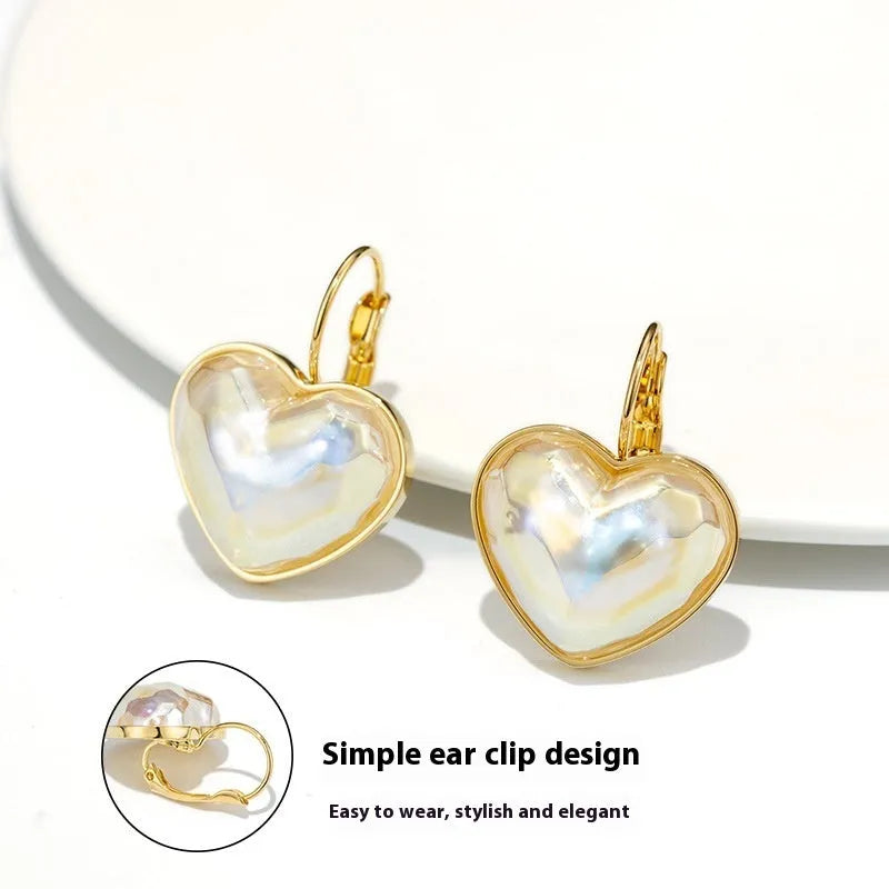 Gold coloured alloy women's ear clip with natural style and metal decorative elements.