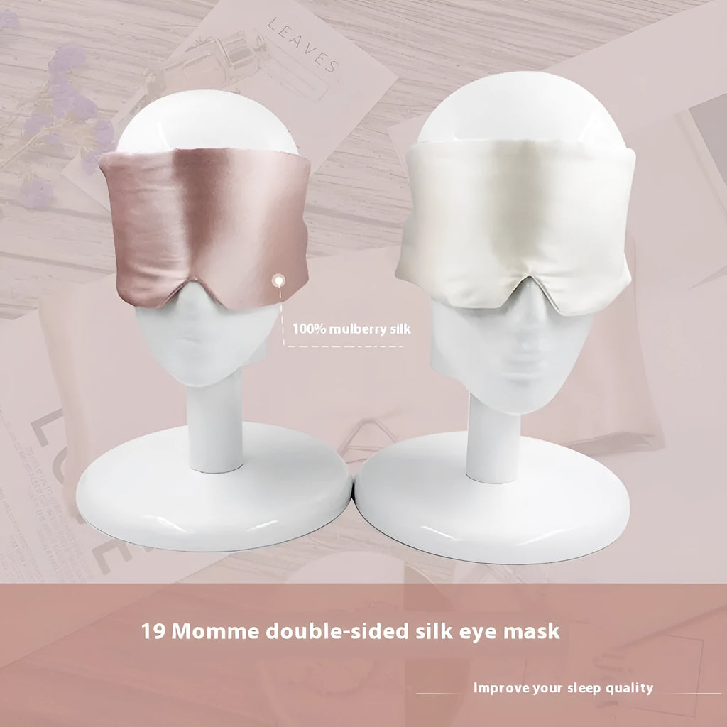 Mulberry silk sleep eye mask shown in champagne gold colour, laid flat on a surface.