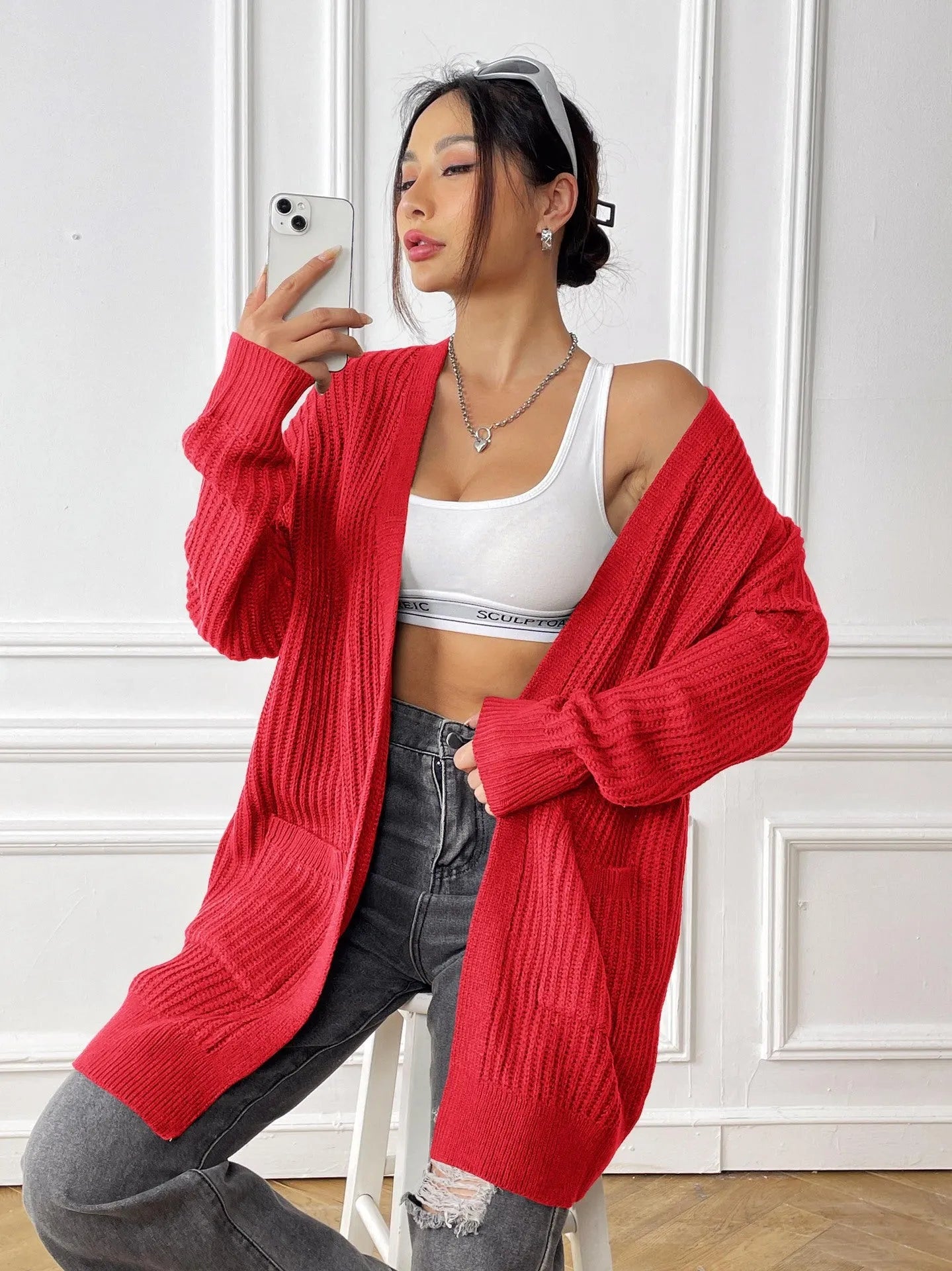 Women's loose fit acrylic cardigan with double pockets in dark green colour