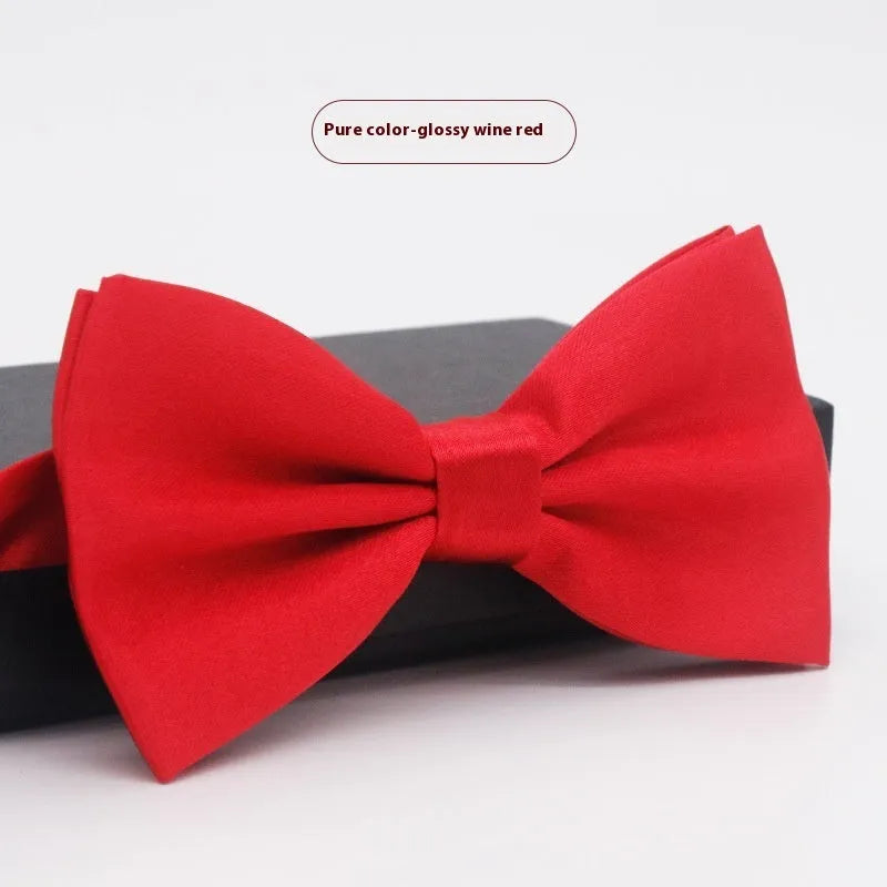 Solid colour flat head bow tie for formal wear in multiple colours including black, red, and blue.