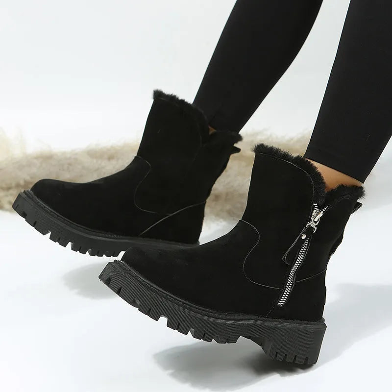 Women's black thick plush high top snow boots with side zipper and round toe on a rubber sole.