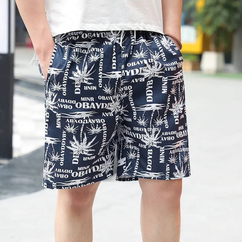 Men's floral print five-point swimming trunks in polyester, showing one of 24 available colour patterns.