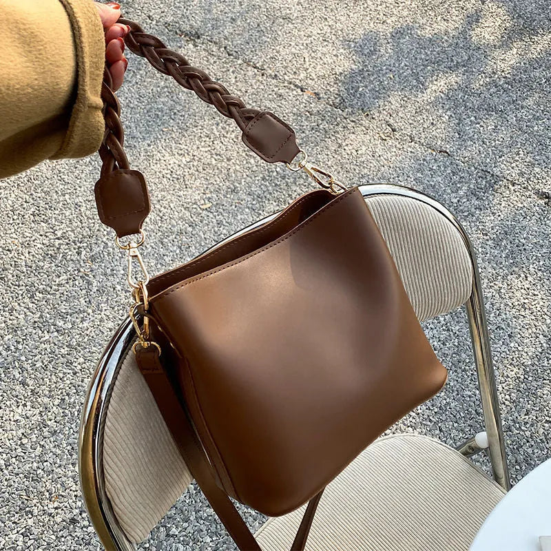 Woven PU one-shoulder crossbody bucket bag in retro style, shown in khaki colour.