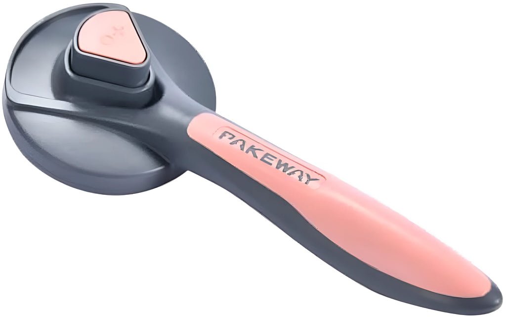 Grey self-cleaning slicker brush for grooming cats and dogs on a wooden table.