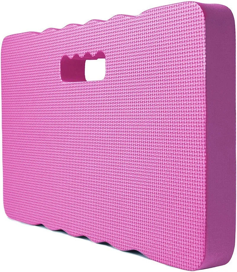 Blue EVA foam garden kneeler pad on grass, showing size next to gardening tools.