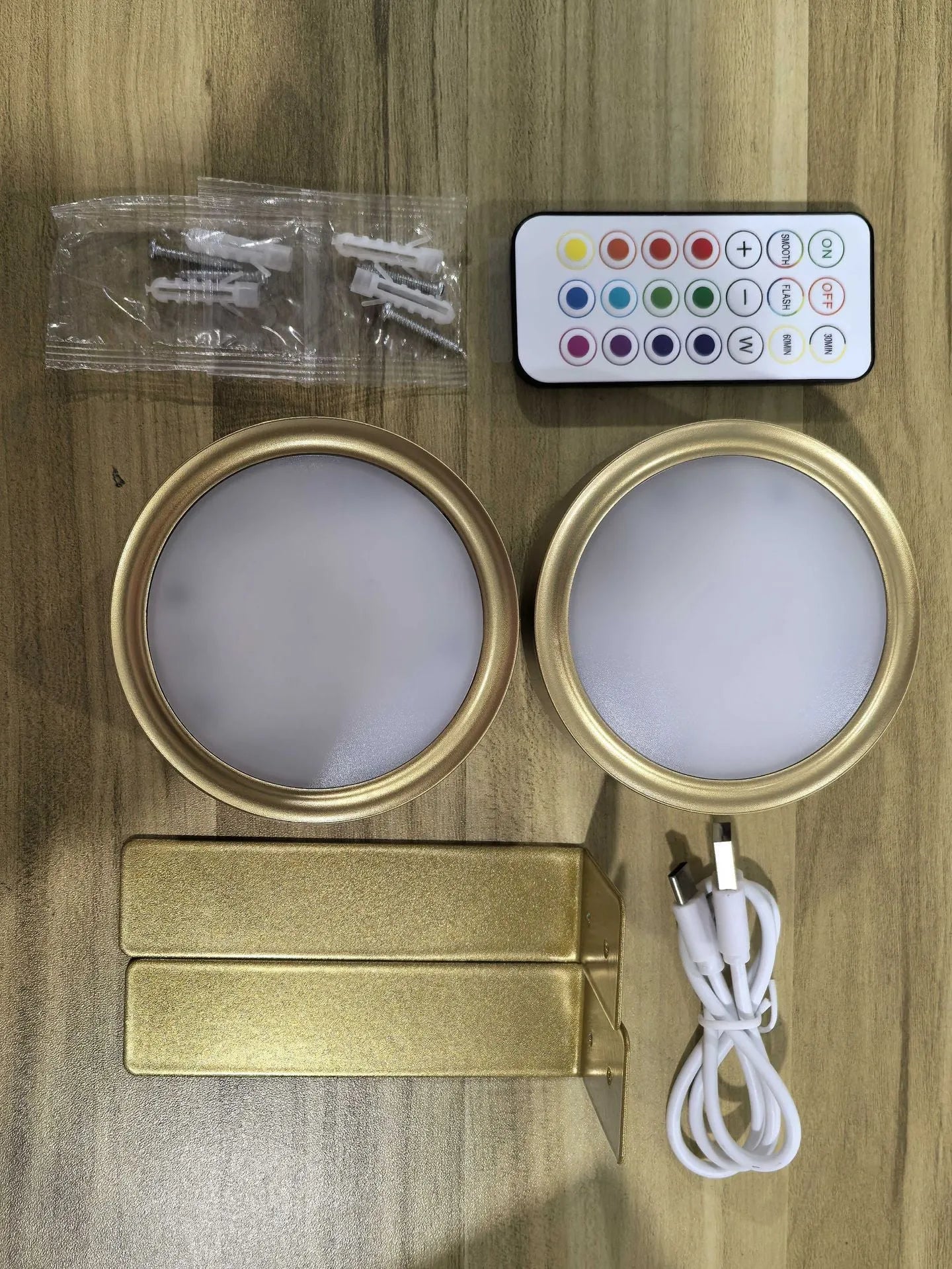 Wireless LED painting lamp with a magnetic mounting belt and remote control in black finish.