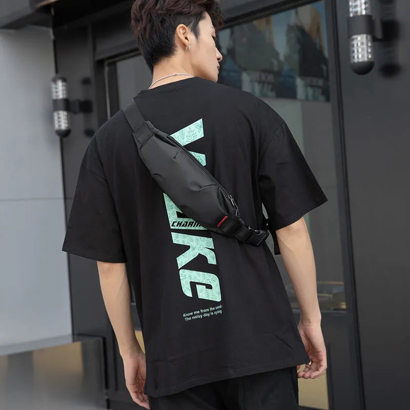 Black Oxford cloth men's crossbody waist pack showing internal phone and ID pockets