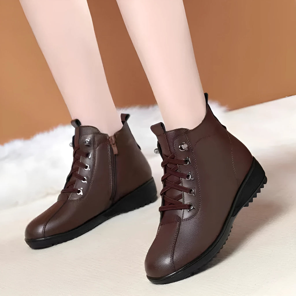 Women's casual shoes in black artificial PU with mid heel, side zipper, and round toe on light background