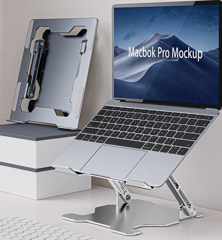 Grey aluminum folding laptop stand shown at an adjustable angle holding a silver laptop.