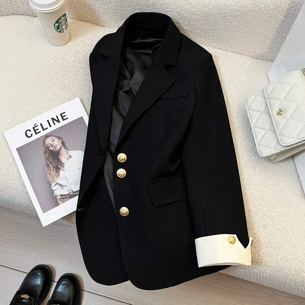 Korean-style loose-fit women's coat in beige and black, showing long sleeves and pockets.