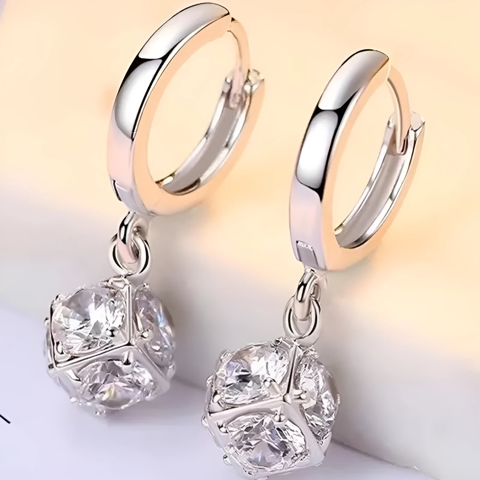 A pair of simple geometric rose-inspired earrings for women, made from electroplated copper, shown in one of the available colour types.