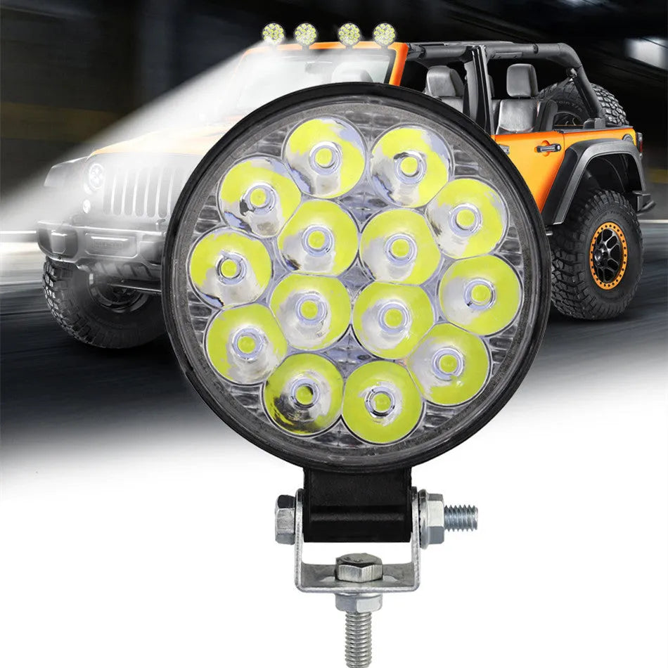 White mini round aluminium LED work light for car, truck, or boat with 42W power and IP67 rating.