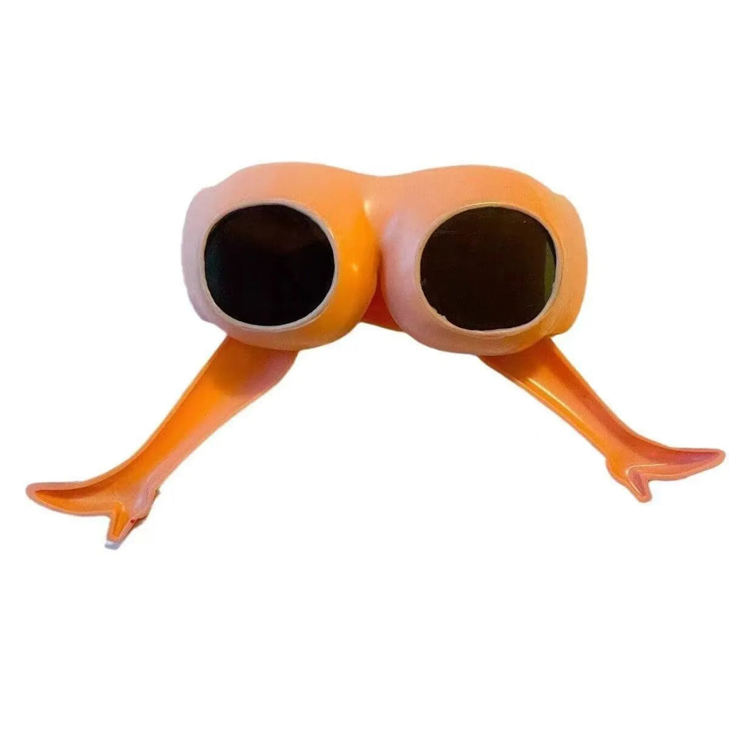Orange plastic novelty sunglasses with leg and hip design on frame