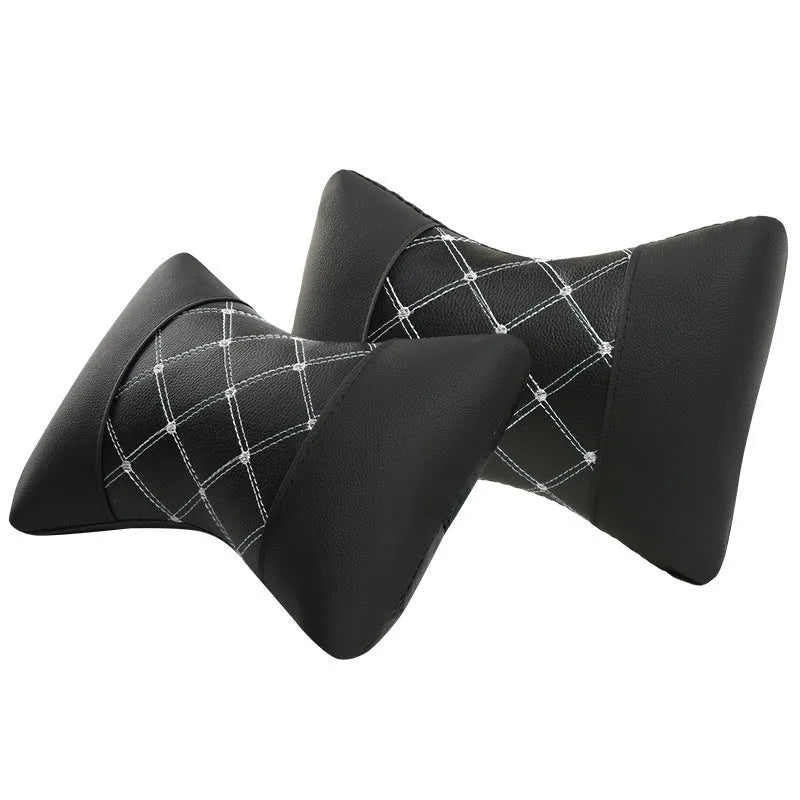 Black quilted diamond pattern car headrest pillow with coloured stitching for neck support.