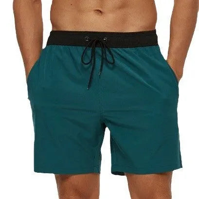 Men's blue running shorts with a stitching waistband, drawstring, and a side zippered pocket.