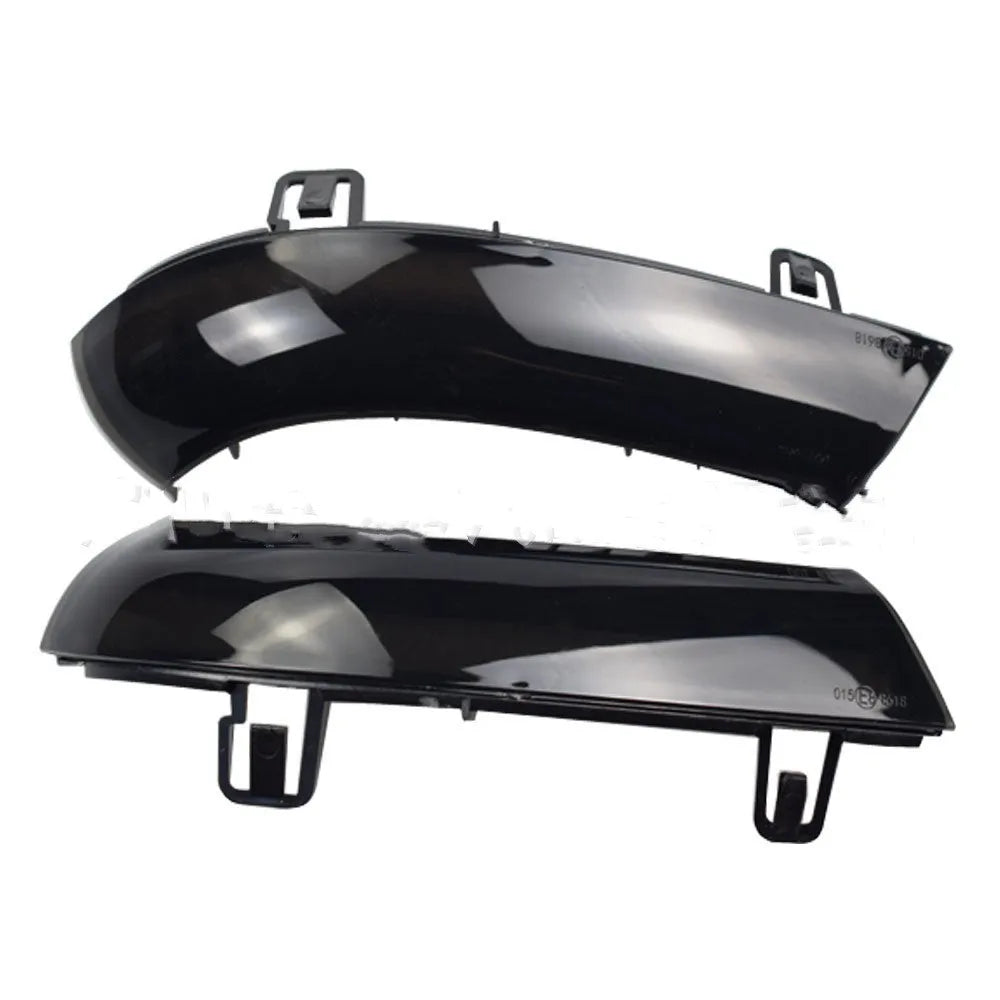 Volkswagen Golf MK5 front end with dynamic sequential amber and blue turn signal lights illuminated.
