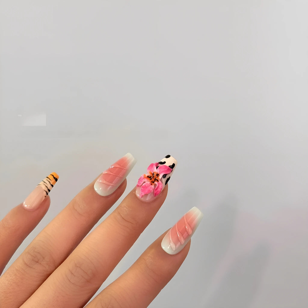 Set of false nails with zebra stripe, lily flower, and leopard print hand carving designs in long, wear-resistant style.