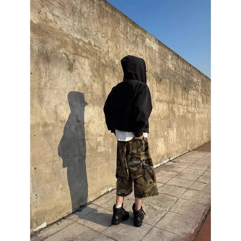 Men's loose straight leg jeans in camouflage colour with ripped patch details and a cropped ankle length