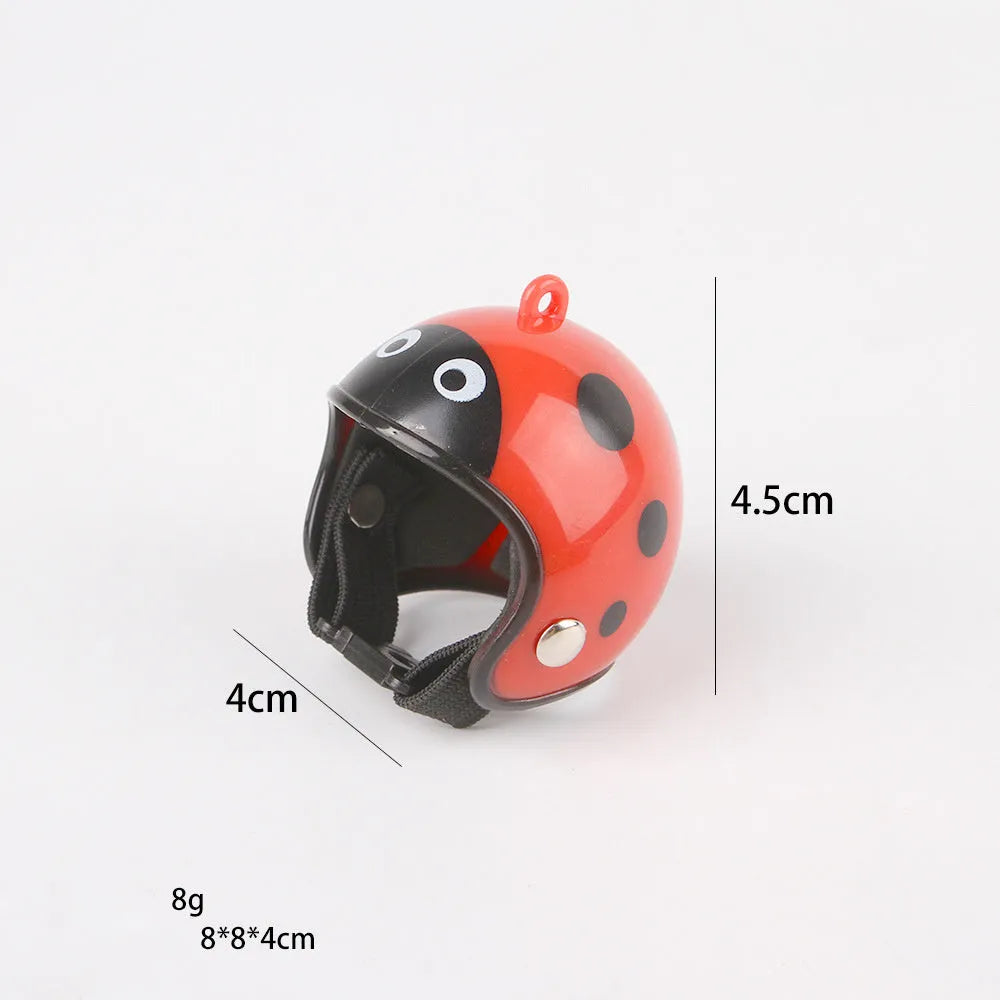 Small adjustable plastic safety helmet for a chicken or bird, shown in a fun design.