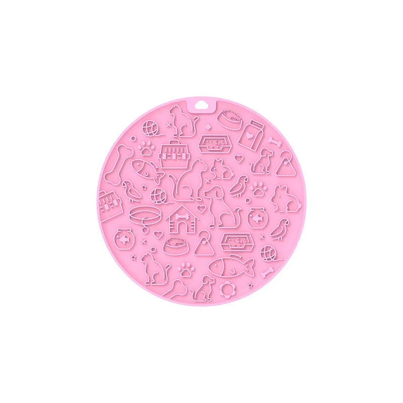 A blue silicone pet licking mat with a suction cup base on a kitchen floor.