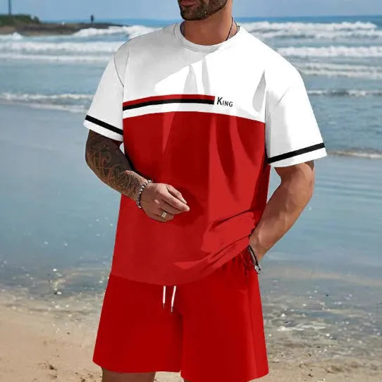 Man wearing a loose blue short-sleeved t-shirt and matching shorts from a summer leisure set.
