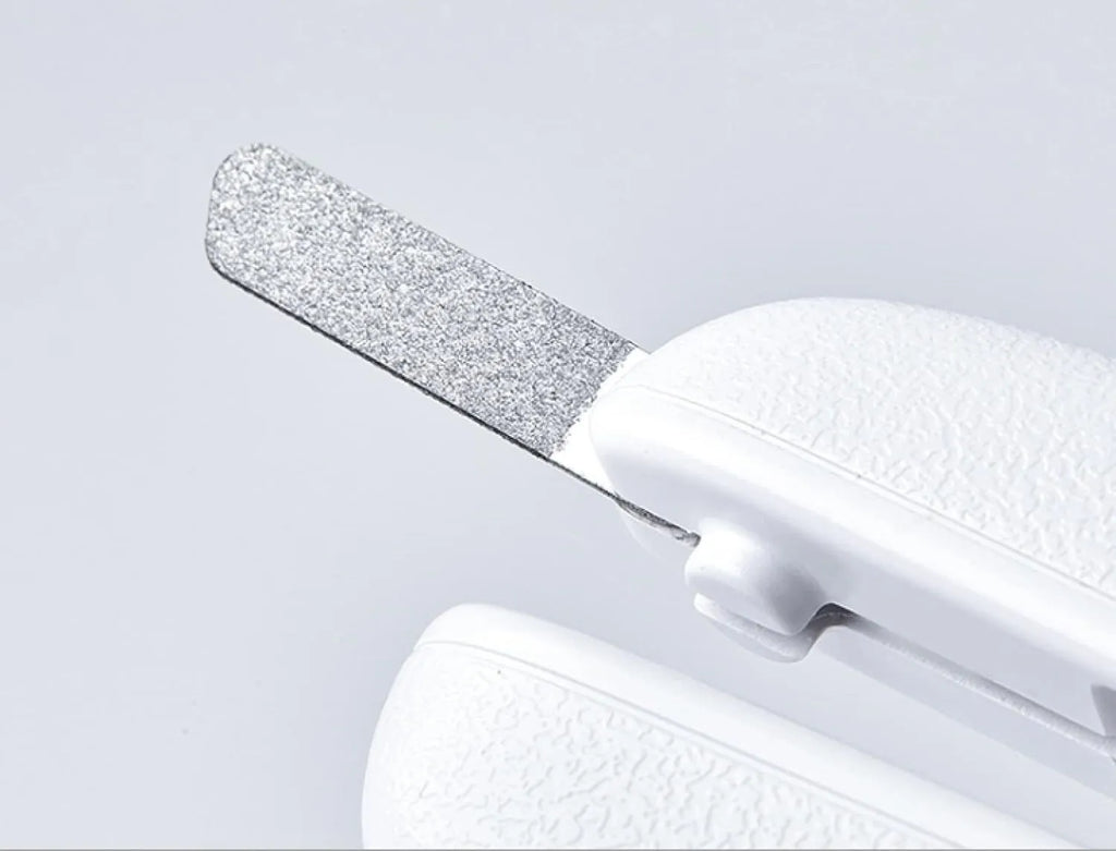 White pet nail clippers with LED light and transparent anti-splash guard for cats and dogs