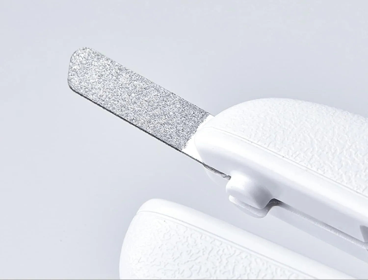 White pet nail clippers with LED light and transparent anti-splash guard for cats and dogs