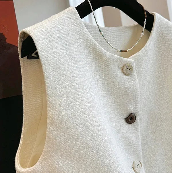 Women's French style bandage vest in milky white polyester with round neck and sleeveless design
