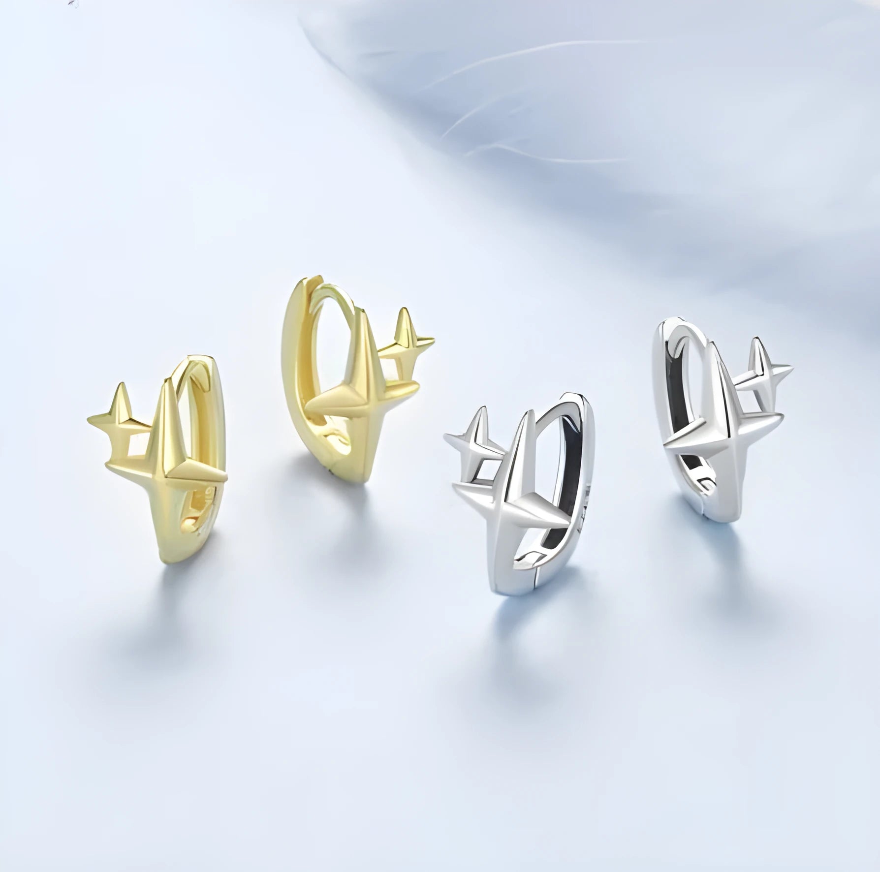 Minimalist star sterling silver ear clips with oxidation finish and XINGX design element