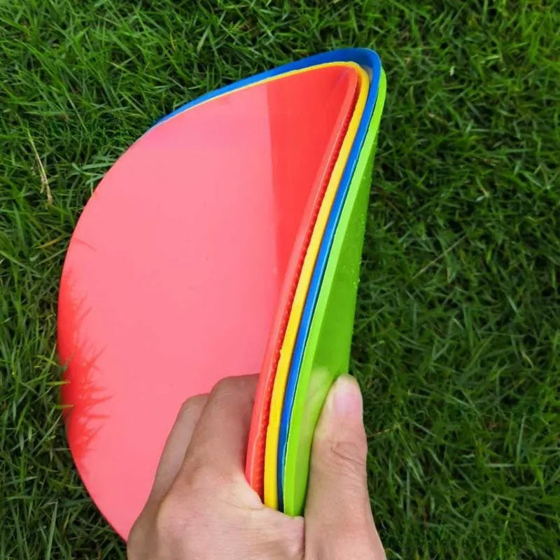 Soft yellow football landmark pad disc on grass, 23cm diameter, for training targets.