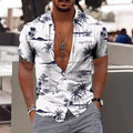 A man's loose-fitting short sleeve cardigan-style top with a colourful floral print.