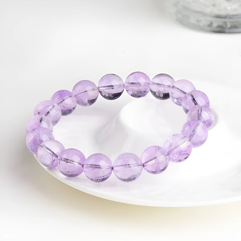 Lavender amethyst round bead bracelet with water ripple geometric pattern showing light purple crystal beads