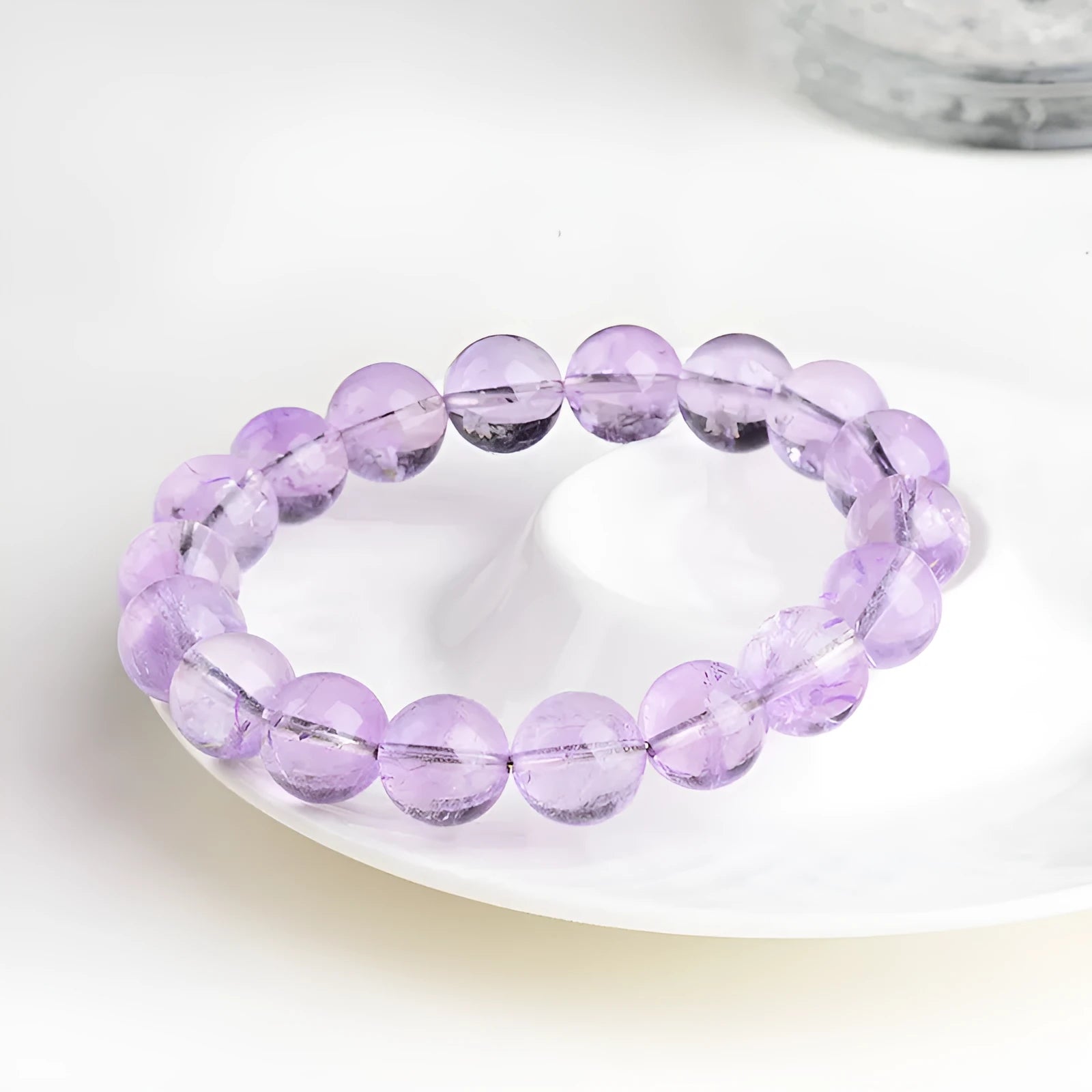 Lavender amethyst round bead bracelet with water ripple geometric pattern showing light purple crystal beads