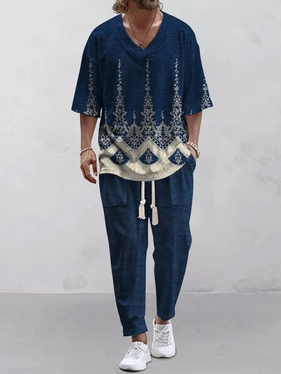 Thin polyester fibre co-ordinated suit with V-neck top, cropped sleeves, and matching trousers on a hanger.