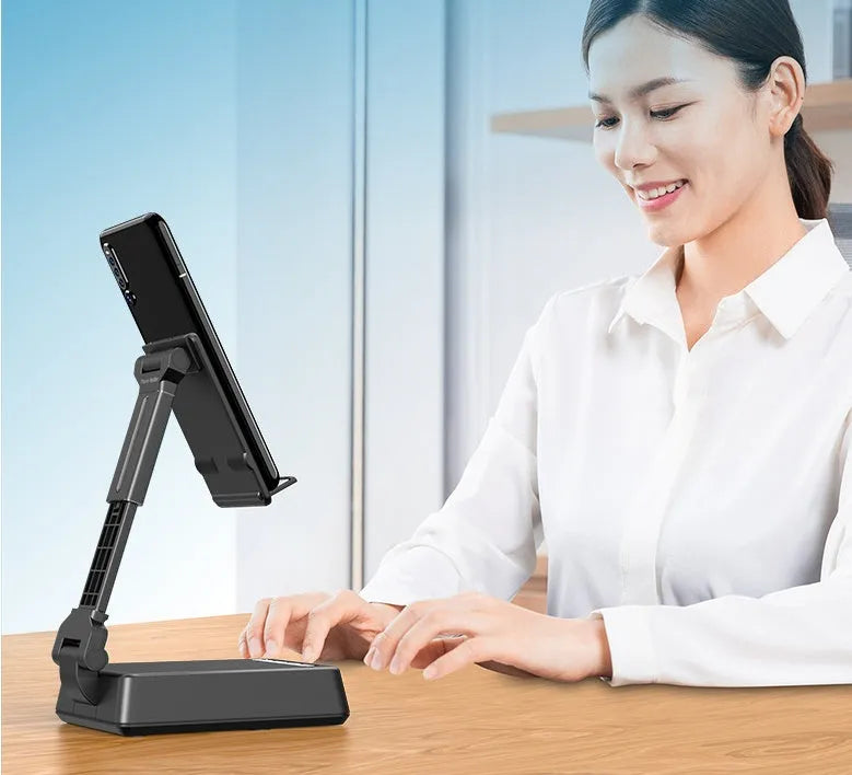 Black mobile phone broadcasting stand with integrated Bluetooth speaker and microphone on desk