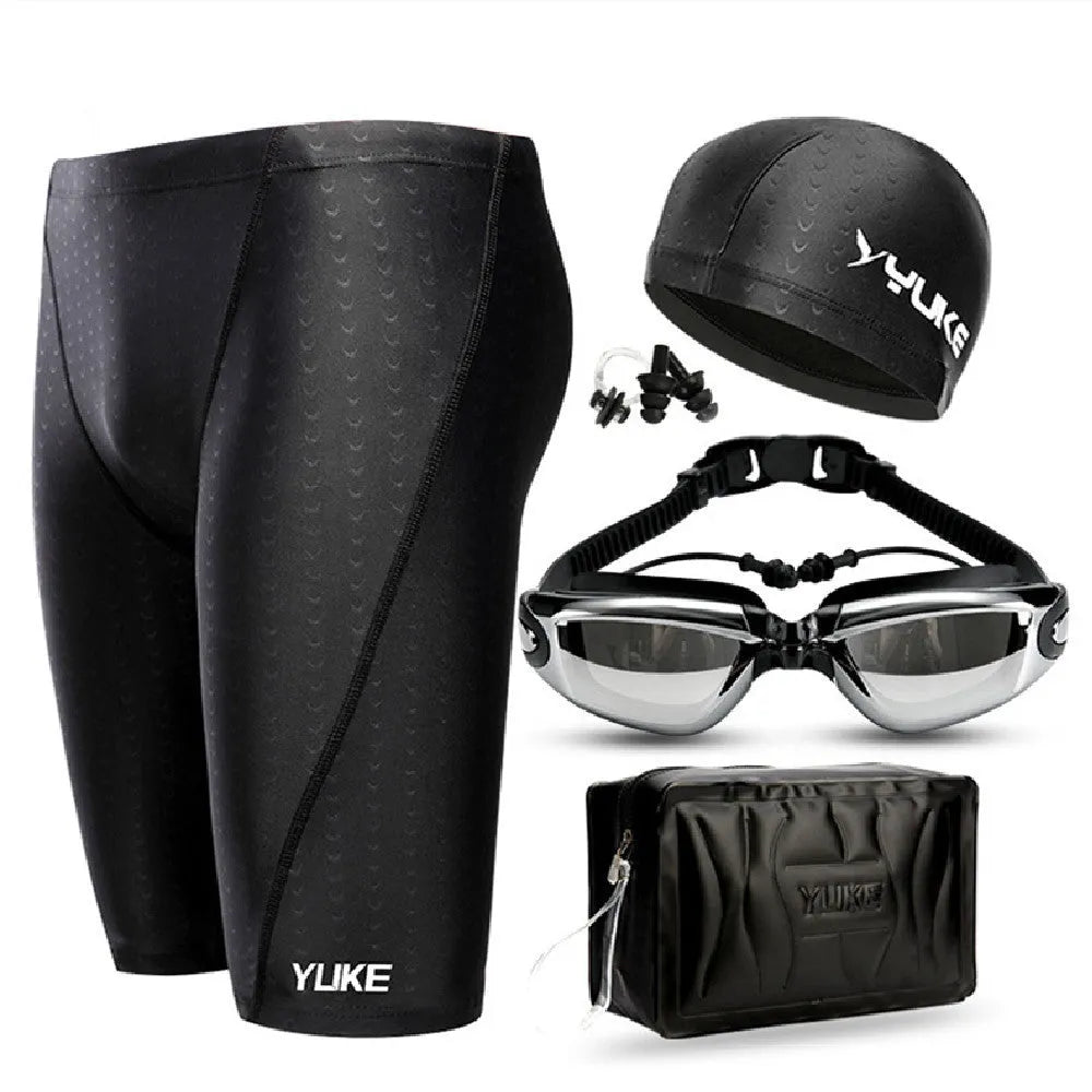 Men's black swim set with trunks, anti-fog goggles, waterproof cap, ear plugs with nose clip, and swimming bag