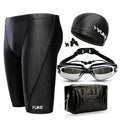 Men's black swim set with trunks, anti-fog goggles, waterproof cap, ear plugs with nose clip, and swimming bag