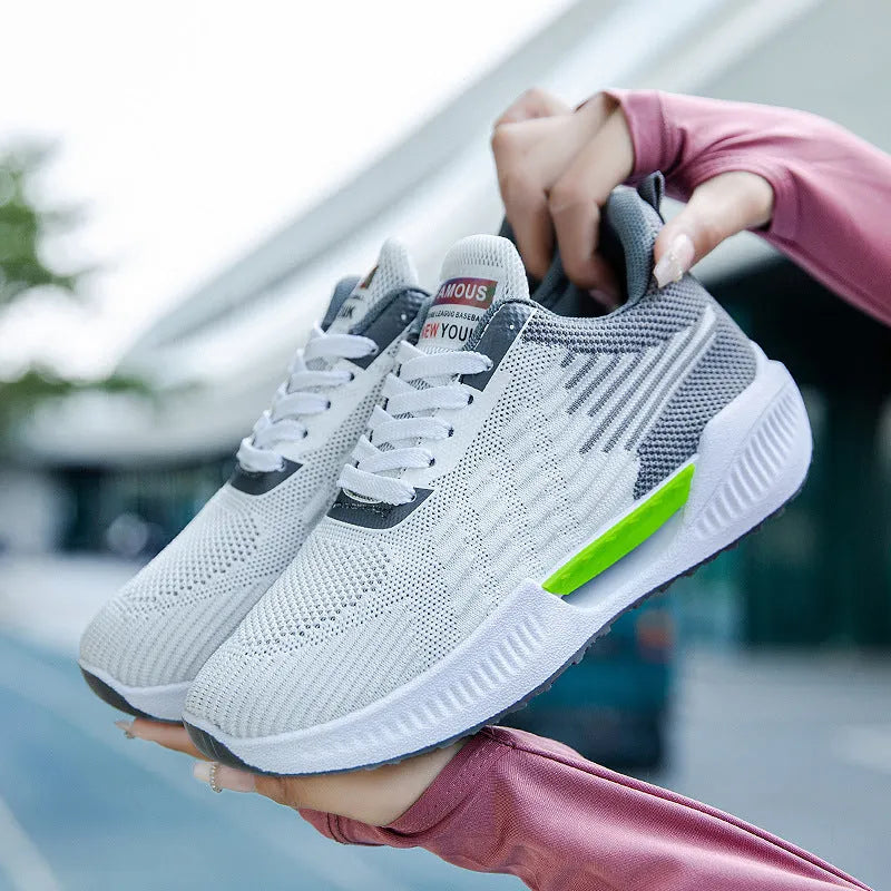 Men's blue breathable casual sports shoe with cloth upper and plastic sole on a white background.