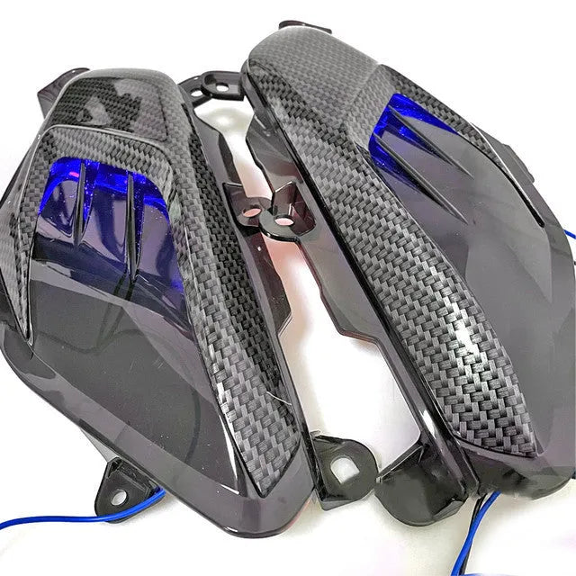 Pair of YAMAHA NMAX carbon fibre LED side lamps with blue or red light options.