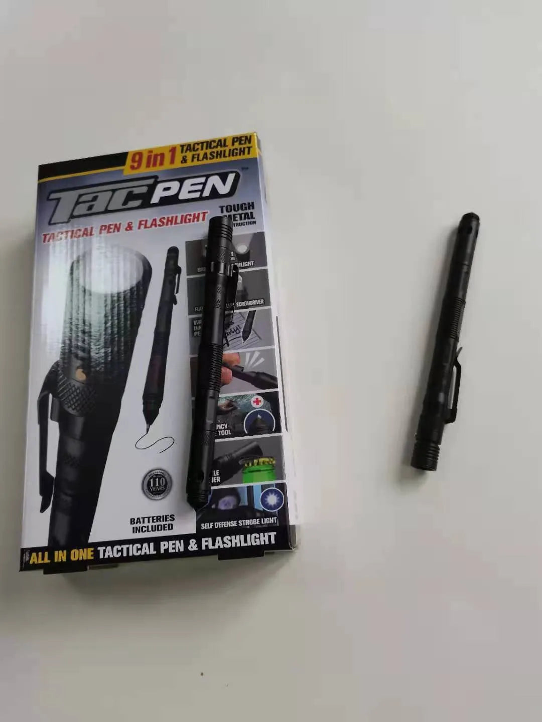 Black nine-in-one multi-function flashlight pen with car window breaker and dual light source for EDC outdoor use