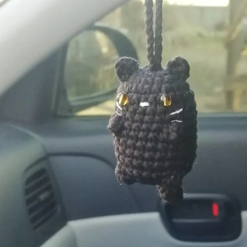Plush hand-woven polyester automobile hanging ornament with cartoon style design on car dashboard