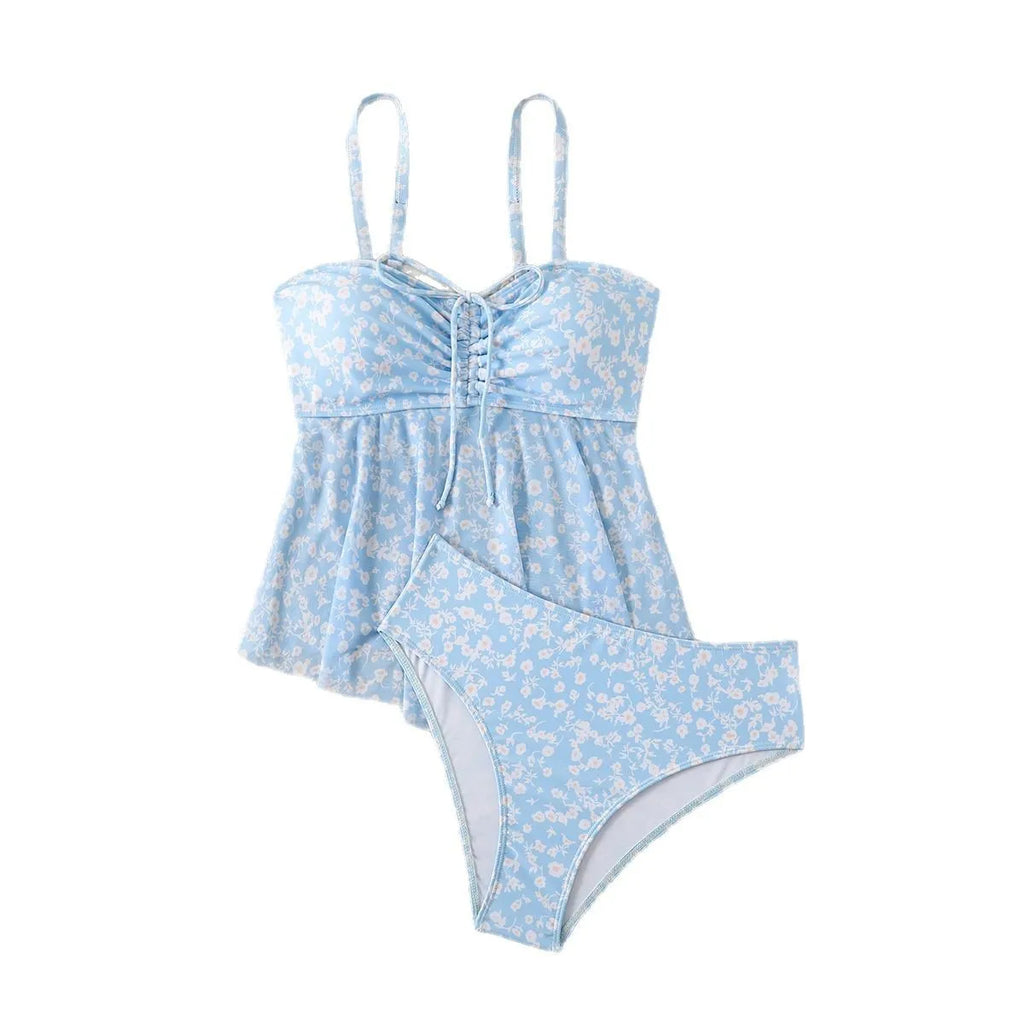 Light blue floral women's swimsuit set with shoulder straps and backless design, available in sizes S to XL