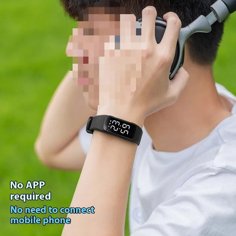Vibration alarm smart watch with coloured silicone strap and LED display on wrist